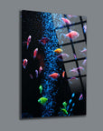 Colorful aquarium fish swimming in a vibrant underwater scene, showcased on high-quality glass art.