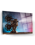 Vintage film projector on a beautifully designed glass artwork, showcasing its detailed craftsmanship.
