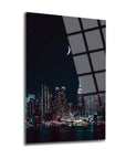 New York City skyline night view on high-quality glass panel, featuring bright city lights and a crescent moon.