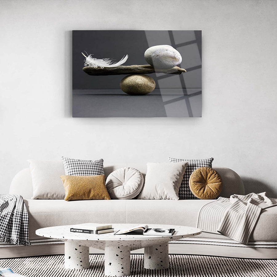 Denge Cam Tablo featuring a modern design with feather, stone, and wood elements, set in a stylish living room.