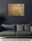 Modern decor featuring a golden patterned wall art above a gray sofa in a stylish living room setting.