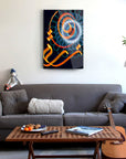 Zuhra Cam Tablo featuring colorful spiral art, displayed above a modern couch in a cozy living room setting.