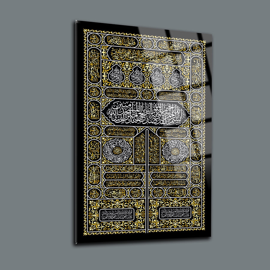 Elegant glass wall art featuring intricate gold and black Islamic calligraphy design.