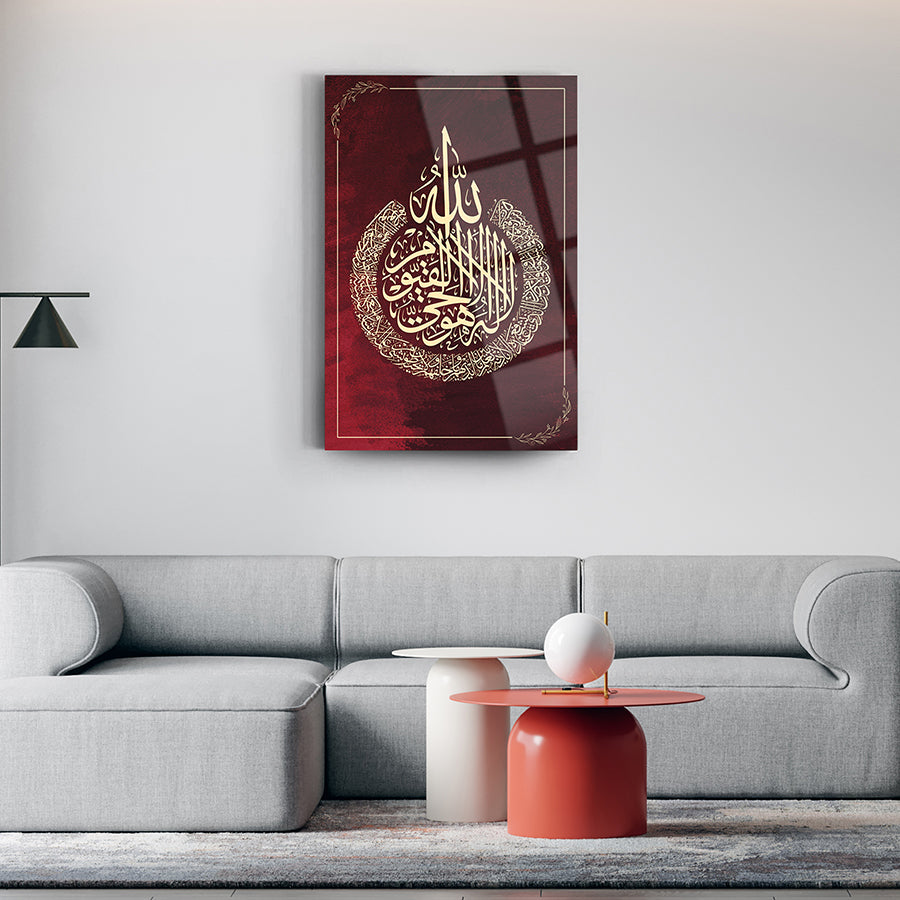 Ayetel Kürsi glass wall art in a stylish living room, showcasing elegant calligraphy on a luxurious red background.
