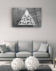 Bismillahirrahmanirrahim art on glass in stylish living room with modern decor and geometric sculptures.