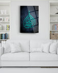 Modern cam tablo featuring Arabic calligraphy design in turquoise, beautifully displayed over a white sofa.