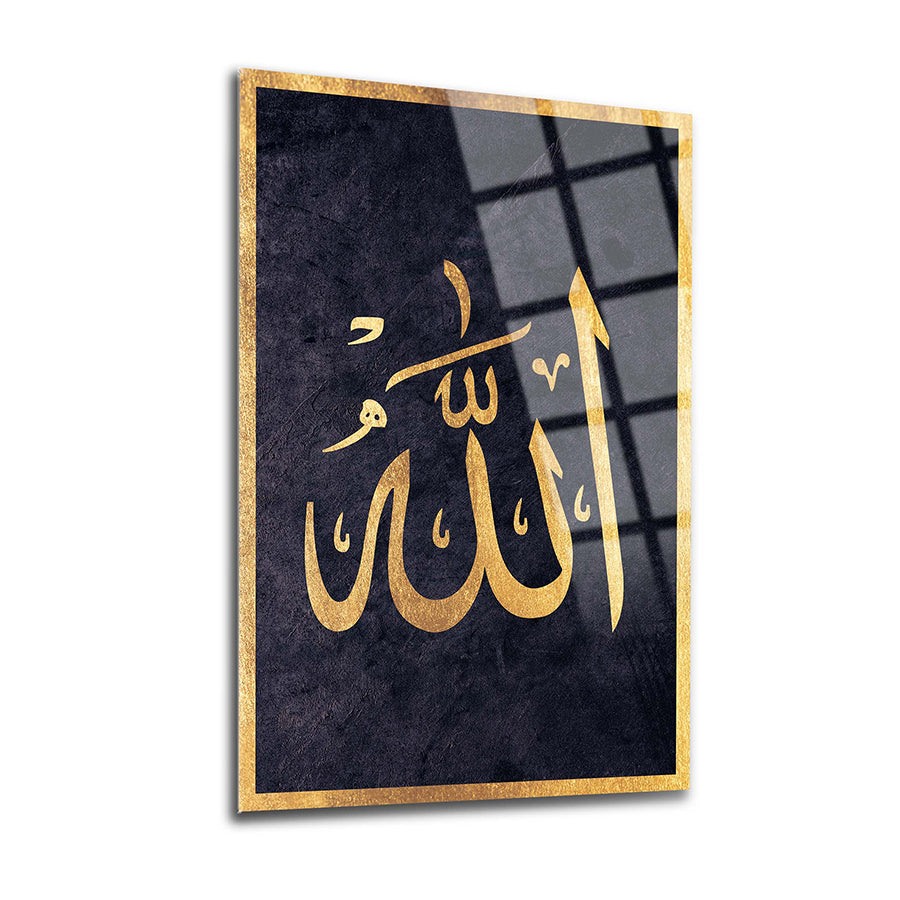 Elegant glass art featuring the Arabic calligraphy of Allah in golden lettering on a dark background.