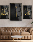 Elegant 3-piece glass wall art set featuring Arabic calligraphy of Allah, Muhammed, and Elif on a stylish living room wall.