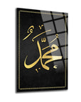 Sleek glass artwork featuring elegant Arabic calligraphy of the name Muhammad on a black background.