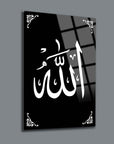Black glass wall art featuring the Arabic calligraphy for 'Allah' with decorative corners.