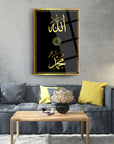 Allah Muhammed glass wall art in stylish living room, featuring black background and gold lettering.