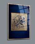 Muhammed S.A.V. calligraphy artwork on a blue background, elegantly framed for wall display.