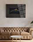 Modern 3D glass wall art featuring geometric design above a brown leather sofa.