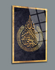 Gold Arabic calligraphy art on glass, featuring a decorative design, ideal for home decor.