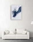 Modern Melek Cam Tablo featuring abstract design in dark tones above a stylish white couch in minimalist living room.