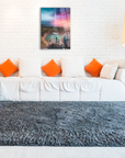 Rengarenk Eyfel Cam Tablo above a stylish couch in a modern living room with orange cushions and a cozy rug.