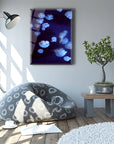 A stylish living room featuring a Deniz Anası Cam Tablo, bean bag chair, modern lamp, and indoor plant.