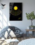 Modern living room featuring a sun-themed artwork, a cozy bean bag, and a potted tree for a stylish ambiance.