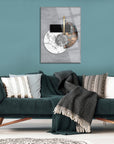 Mermer Dünya Cam Tablo on stylish green wall above modern sofa with cozy blankets and cushions.