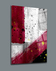 Modern abstract wall art with splashes of red, yellow, and white on a textured background, perfect for home decor.
