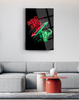 Modern glass artwork featuring a dynamic bear and bull design in red and green, perfect for contemporary decor.