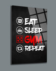 Motivational gym wall art displaying 'Eat Sleep GYM Repeat' on a sleek black background.