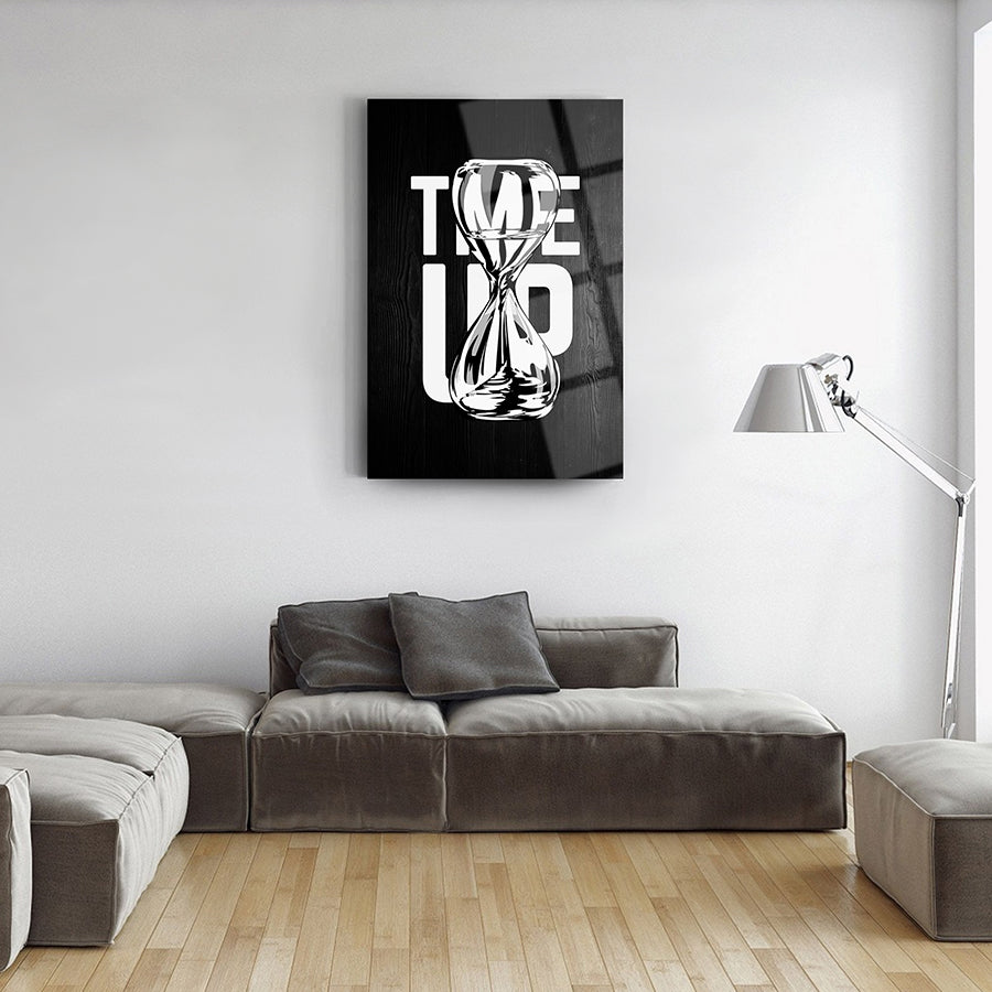 Modern black and white glass wall art featuring an hourglass design with the text 'TIME UP' in a stylish living room.