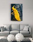 Elegant yellow peacock glass art on a wall above a modern gray sofa in a stylish interior.