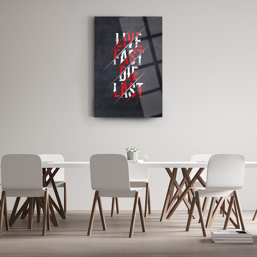 Modern glass wall art with 'Live Fast Die Last' text in a stylish setting, perfect for contemporary decor.