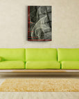 Dumanlı Çizgiler Cam Tablo, modern art piece on wall above green sofa in stylish living room.