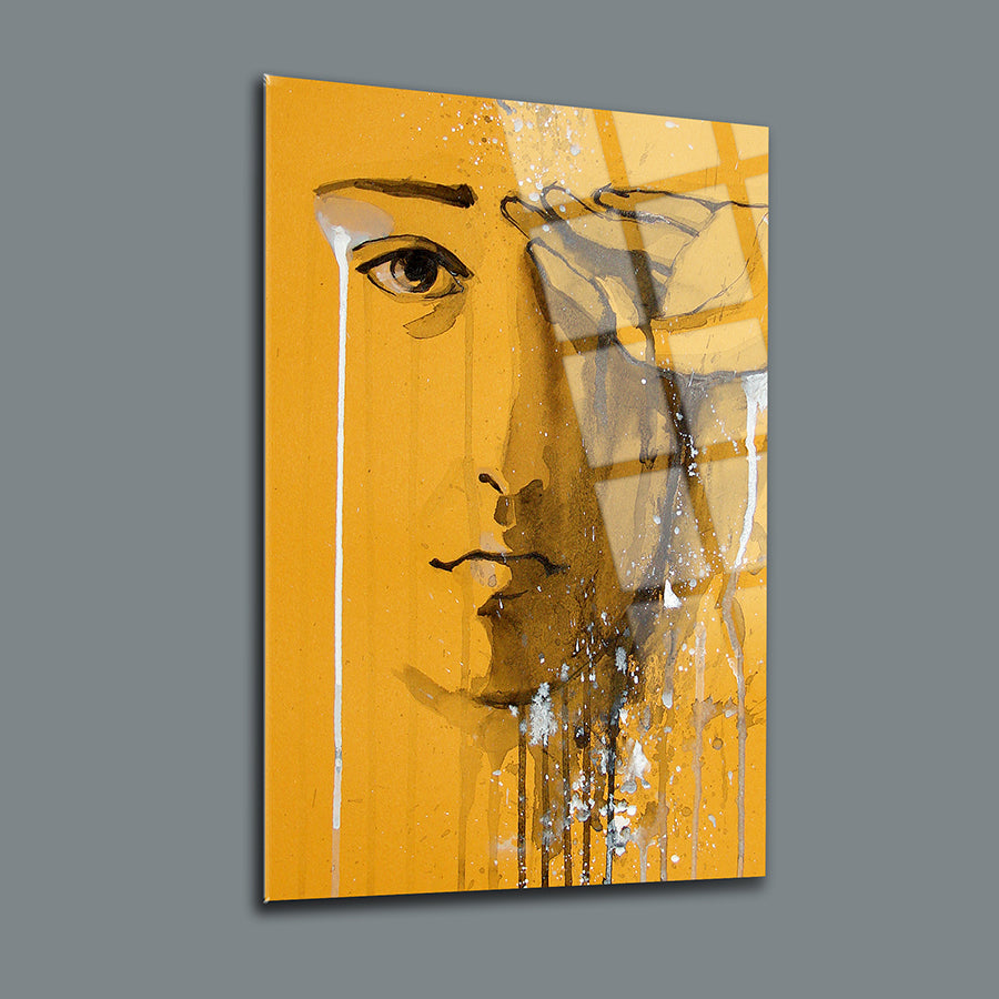 Ağlayan Yüz Cam Tablo by SRD Concept, featuring a stylized face on a vibrant yellow background.