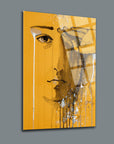 Ağlayan Yüz Cam Tablo by SRD Concept, featuring a stylized face on a vibrant yellow background.
