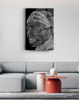 Modern living room featuring a contemporary art piece depicting a stylized face on a black background.