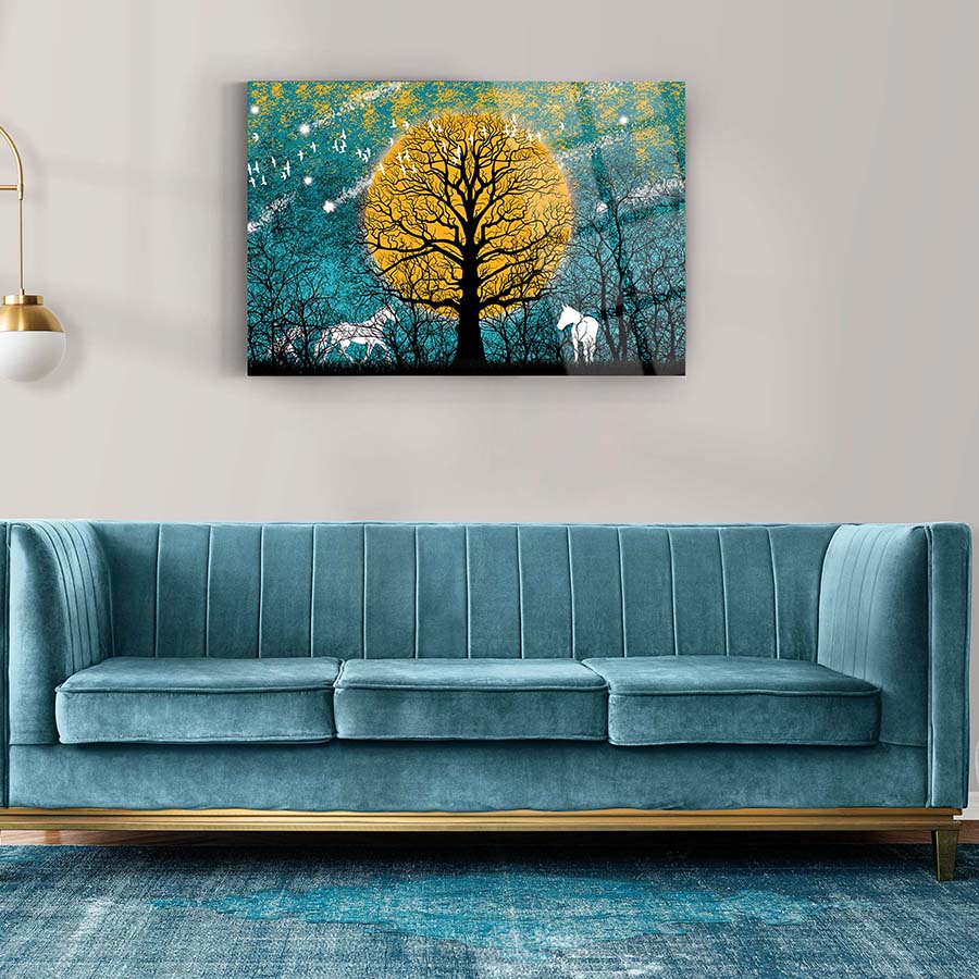 Artistic glass wall art featuring a tree and horses against a vibrant yellow moon, ideal for modern home decor.