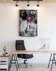 Modern black and white art print with vibrant pink accents in a stylish office setting.