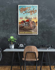 Vintage motorcycle wall art with 'Born to be Wild' slogan in a stylish home office setting.