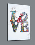 Colorful 'LOVE' artwork on a modern glass panel with intricate designs and textures.