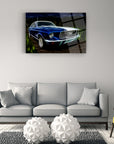 Stylish blue car artwork on canvas above a modern gray couch in a contemporary living room.
