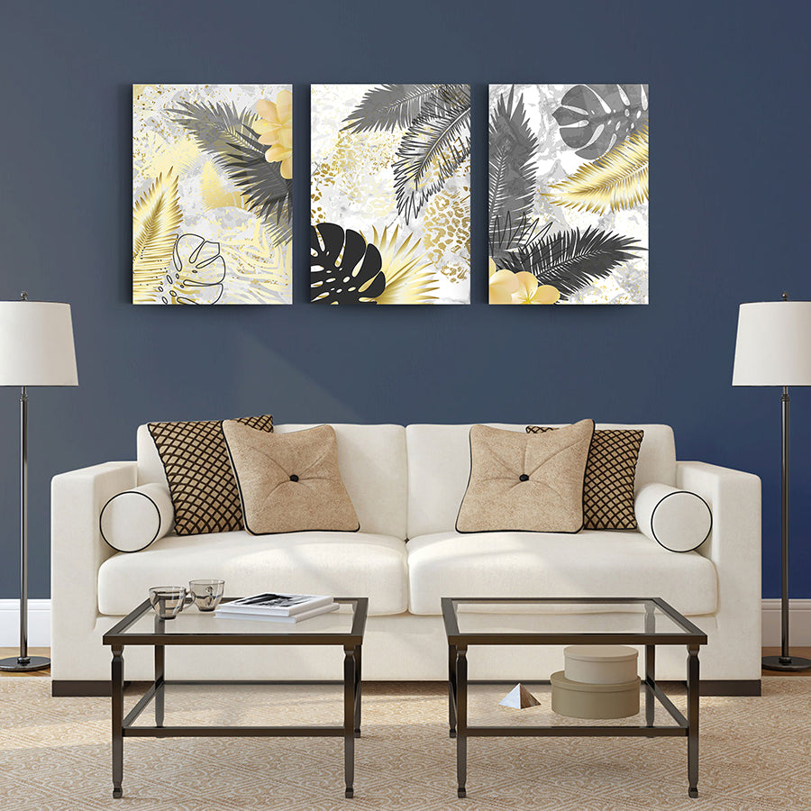 Stylish Areka Palmiye 3'lü Set Cam Tablo displayed above a modern couch in a cozy living room.