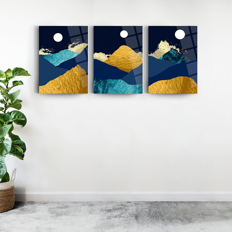 Mavi Altın Dağlar 3'lü Set Cam Tablo; modern tasarım, 4 mm temperli cam, UV baskı, iç mekan dekorasyonu.