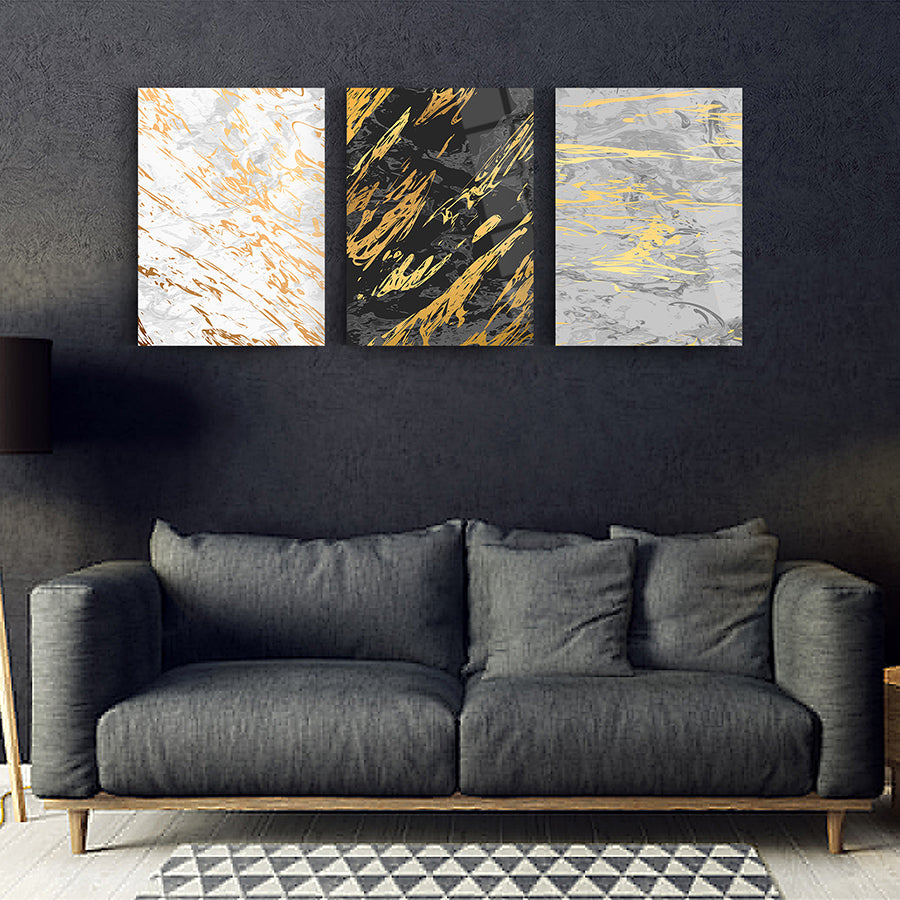 Modern 3-piece glass wall art set with marble designs in gold and black, perfect for stylish home decor.