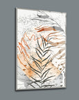 Modern abstract glass artwork featuring layered leaf designs in warm tones and geometric patterns.
