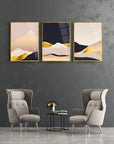 3-piece glass wall art set featuring abstract mountain designs in golden and neutral tones.