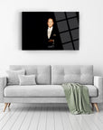 Atatürk 27 Cam Tablo on wall above a modern gray sofa with decorative pillows in a stylish living room.