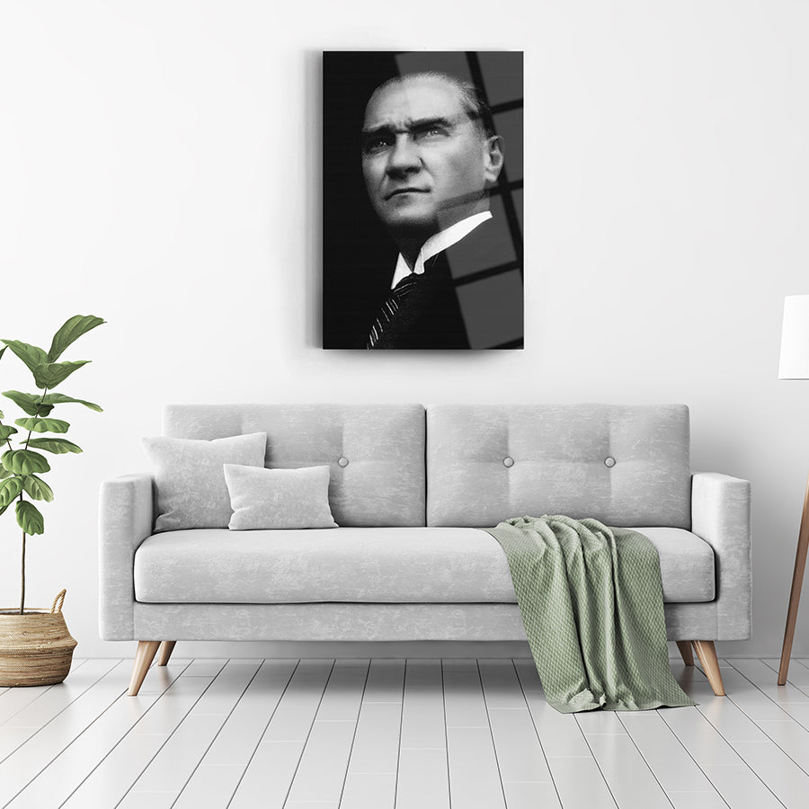 Atatürk 54 Cam Tablo on modern living room wall above sofa with cushions and plant.