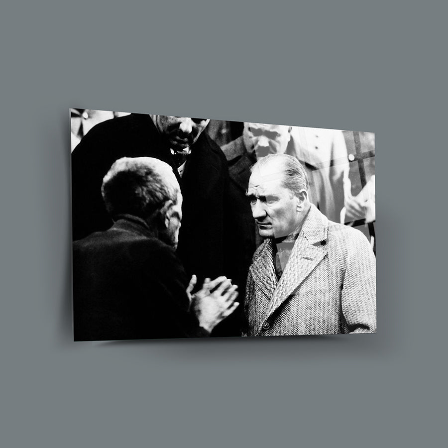 Vintage black and white photo featuring two men in deep conversation.