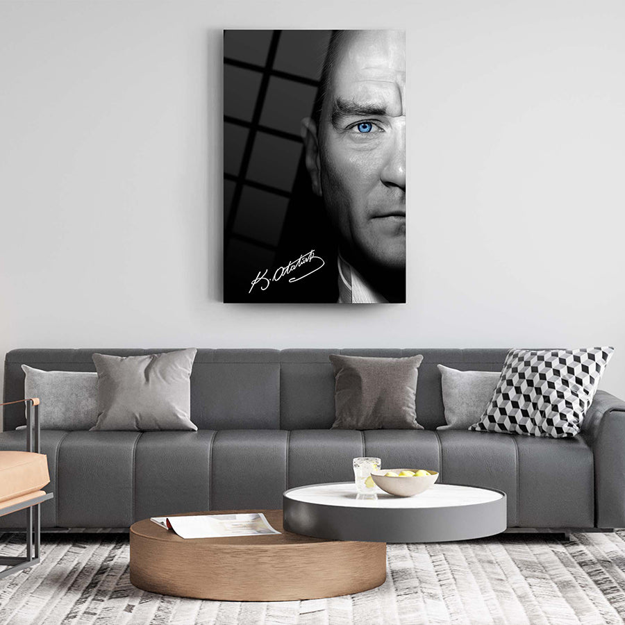 Modern living room with signed portrait artwork and stylish furniture, featuring a striking blue-eyed male subject.