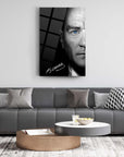 Modern living room with signed portrait artwork and stylish furniture, featuring a striking blue-eyed male subject.