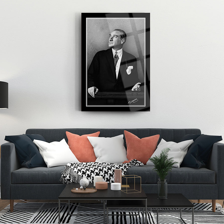 Elegant living room featuring a black and white portrait art piece, framed above a stylish couch.
