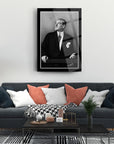 Elegant living room featuring a black and white portrait art piece, framed above a stylish couch.
